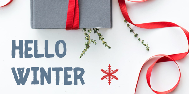 Gray Book with Red Ribbon on White Background with Red Snowflake and Hello Winter Text Gray Book with Red Ribbon on White Background with Red Snowflake and Hello Winter Text