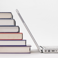Stack of books and laptop