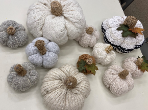 A photo of several of pumpkins made from old sweaters.