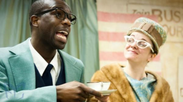 Photo of a team of sled dogs pulling a human in a dog sled race. Photo courtesy of Karen Land. 