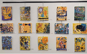 A photo of community created art hanging on the Glencoe Library's art wall. 