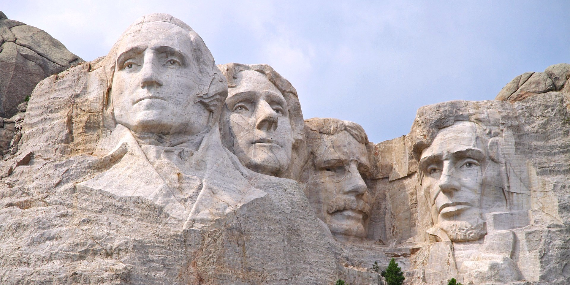 Four U.S. Presidents' faces carved into Mount Rushmore.