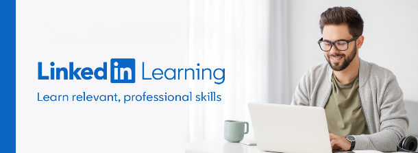 Smiling man using a laptop with text overlay, 