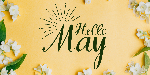 Laptop and Stack of Books Against Gray Bricks with Green Shape Containing Events This Week Text