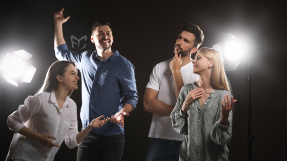 Four adults doing improv together. 