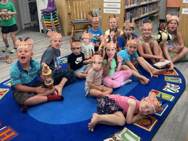 A group children gathered for a storytime.