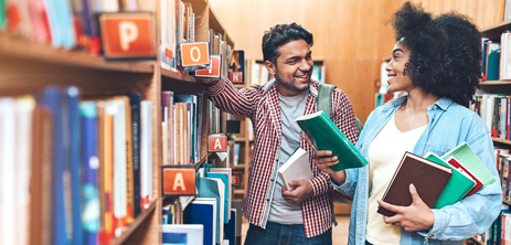Two University Students Talking in the Library