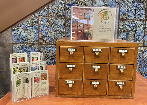 Photo of a small card catalog being used for a seed library at Pewaukee Public Library. Photo of a small card catalog being used for a seed library at Pewaukee Public Library.