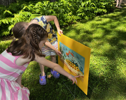 Photo of two children outside read a board at Brookfield Public Library. Photo of two children outside read a board at Brookfield Public Library.