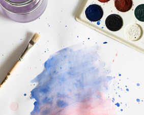 Paint brush, paints and watercolors on paper.