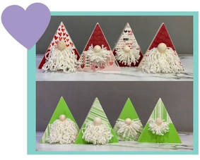 Photo of eight craft gnomes made out of triangle shaped wood.