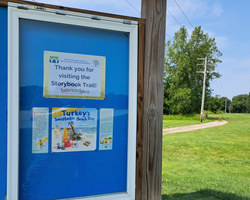 Photo of the first page of the Storybook Trail board outside for the Watertown Public Library. Photo of the first page of the Storybook Trail board outside for the Watertown Public Library.