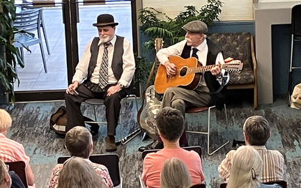 Poor Howard performing in the library's main seating area