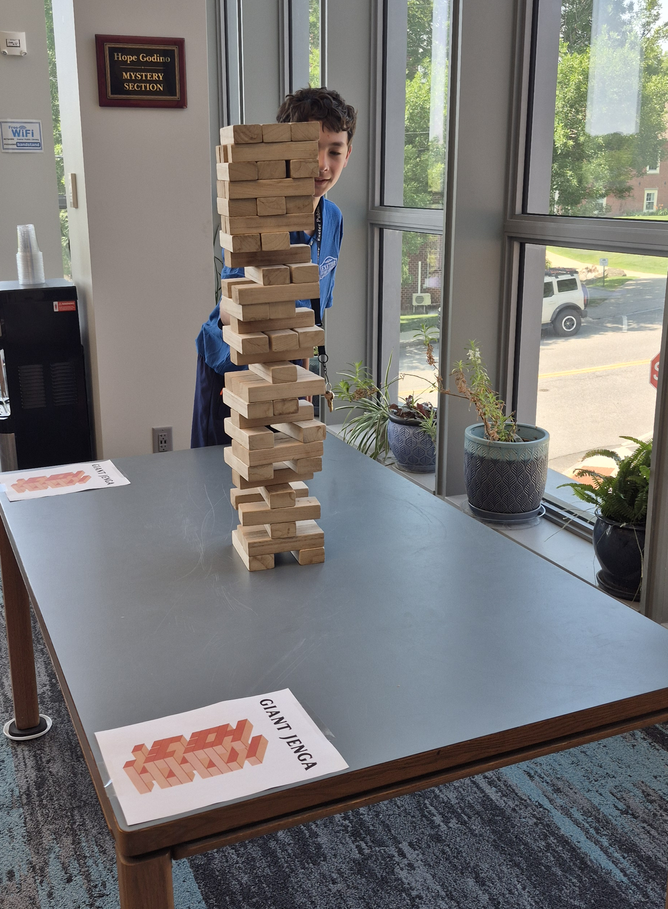 Giant Jenga on a table for the Kickoff Party.