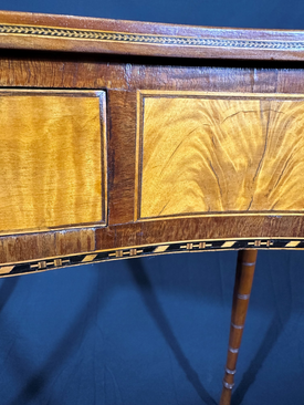 close-up of the front of a pier table with wood inlay