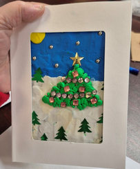 One of the many clay holiday cards created by seniors at CHATS