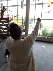 Annwin directing the installation of her exhibit. 